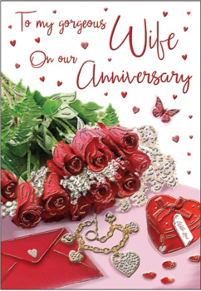 In this richly detailed anniversary card, the scene is arranged with the same artistic sensitivity you might expect from a Chalk Farm florist crafting a bouquet for a local couple. At the centre lies a compact cluster of classic red roses, their petals layered in generous curves that create a sense of depth and movement, as though each flower is slowly unfurling another year of shared memories. Fresh, bright greenery surrounds the roses, framing the arrangement with life and colour reminiscent of walks through nearby Regent's Park. To one side, an unopened envelope lies ready, its smooth, light surface reflecting the ambient daylight and hinting at a handwritten note inside-perhaps recalling strolls past Camden Lock or evenings on Primrose Hill. Resting close by is a small heart-shaped box and a delicate piece of jewellery, their polished surfaces adding a subtle glimmer that speaks of treasured gifts and carefully chosen surprises over the years. Scattered heart motifs and a single butterfly illustration add a gentle touch of whimsy, as if confetti has settled after a private celebration. The card's text is elegantly scripted, its flowing lines mirroring the curves of rose petals and the gentle sweep of foliage. Light falls softly across the entire composition, casting faint shadows and highlighting textures: smooth paper, satin-like petals, cool metal, and glossy finishes. Together they create an atmosphere that is romantic yet intimate, like a quiet anniversary spent at home just off Chalk Farm Road, where the focus is on shared history, quiet gratitude, and love that continues to deepen with every passing year.