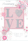 This anniversary card design radiates a sense of cherished intimacy, its gentle colours and delicate artwork mirroring the quiet romantic corners of Chalk Farm. The central focus is the word LOVE, created from softly raised glittered letters that catch the light with a muted shimmer. The letter O is transformed into a textured silver heart, standing slightly proud of the surface, inviting a fingertip to rest there, much like pausing to hold the hand of someone you love while walking past the cafés near Chalk Farm Road. Around this central emblem, a soft arrangement of illustrated blooms opens across the card. Flowers in blush pinks and tender mauves have been painted with a watercolour softness, their edges slightly blurred and translucent, as though seen through a veil of afternoon sunlight. Slender stems and curling tendrils wind between the blossoms, sketched in fine silver-grey lines that swirl gracefully, reminiscent of the organic curves a florist shapes when arranging romantic stems in a vase. Tiny decorative touches-scattered petals, gentle swirls, and subtle butterflies-add motion and whimsy, as if the flowers are caught in a light breeze drifting up from Camden Market. The background remains a calm, pastel pink that lets the central heart and lettering stand out clearly without feeling harsh. Phrases like On Our Anniversary and I love you today and always appear in elegant script, spaced carefully so they frame rather than crowd the design. The card feels like a keepsake-a paper echo of a delicate Chalk Farm anniversary bouquet, speaking softly of shared years, quiet mornings, and the enduring comfort of being together.